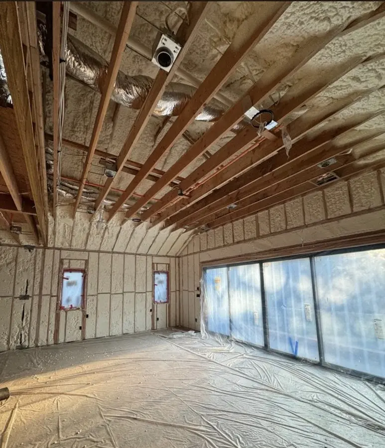 Interior walls and ceiling insulated with spray foam during new construction in Mason City