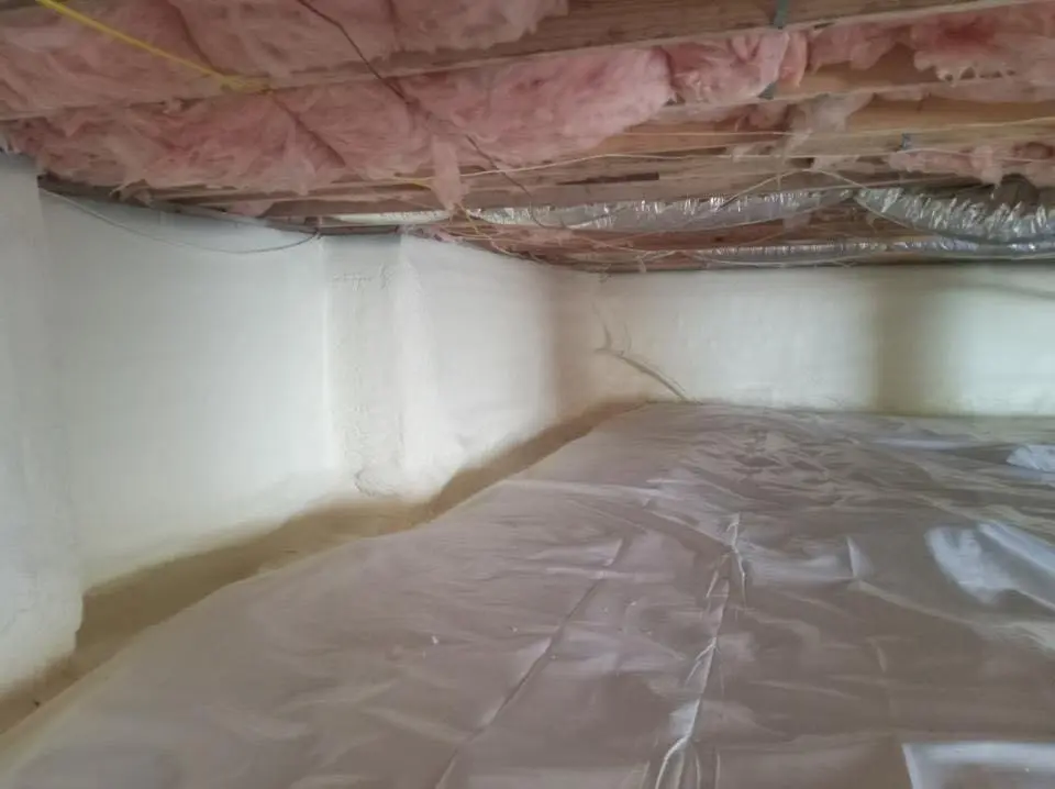 Crawl space encapsulation with closed-cell spray foam for Commercial Roof Restoration in Mason City